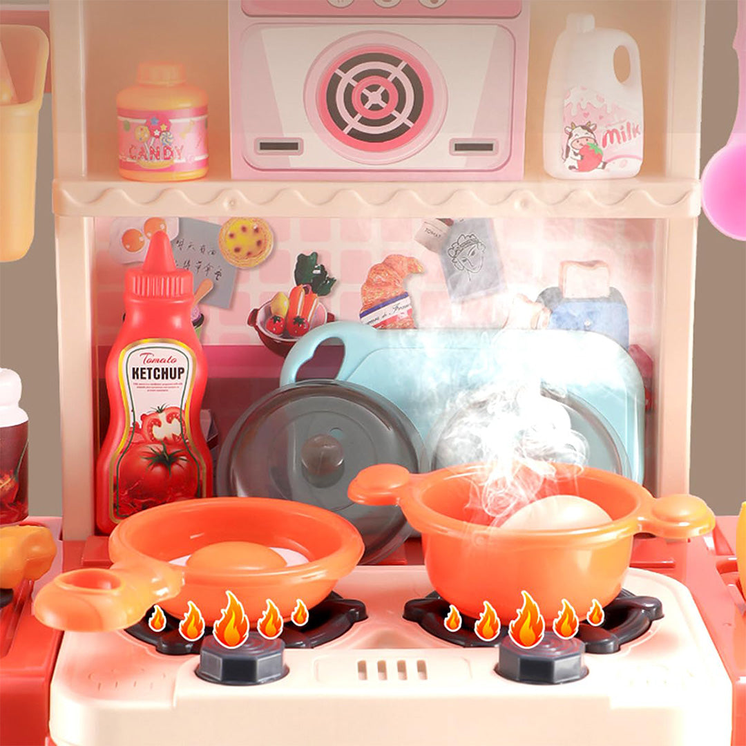 The 43-Piece Kids Toy Kitchen Set in Pink showing the steam and water function.
