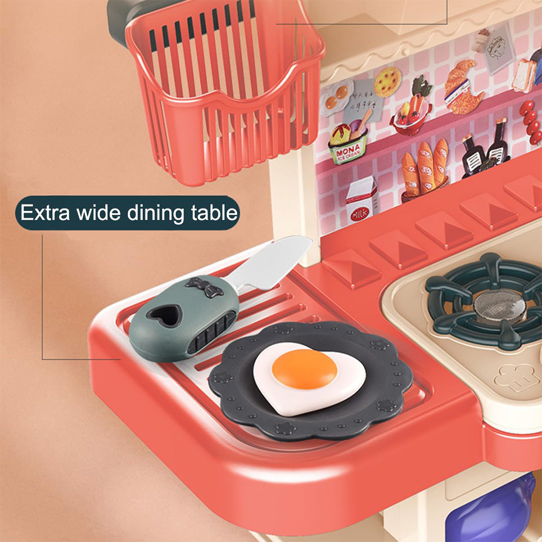 The 43-Piece Kids Toy Kitchen Set in Pink showing the steam and water function.
