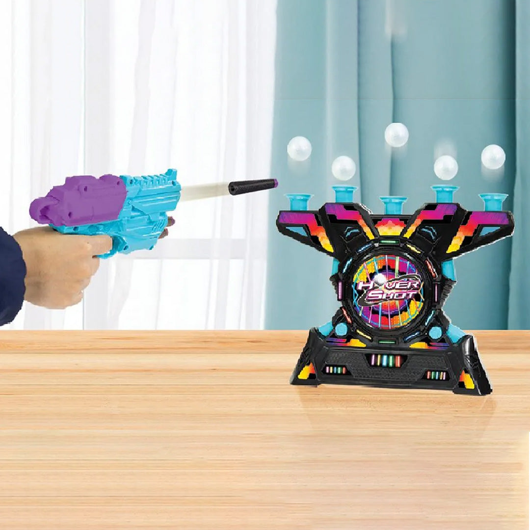 A child aiming the air-powered blaster at the moving targets
