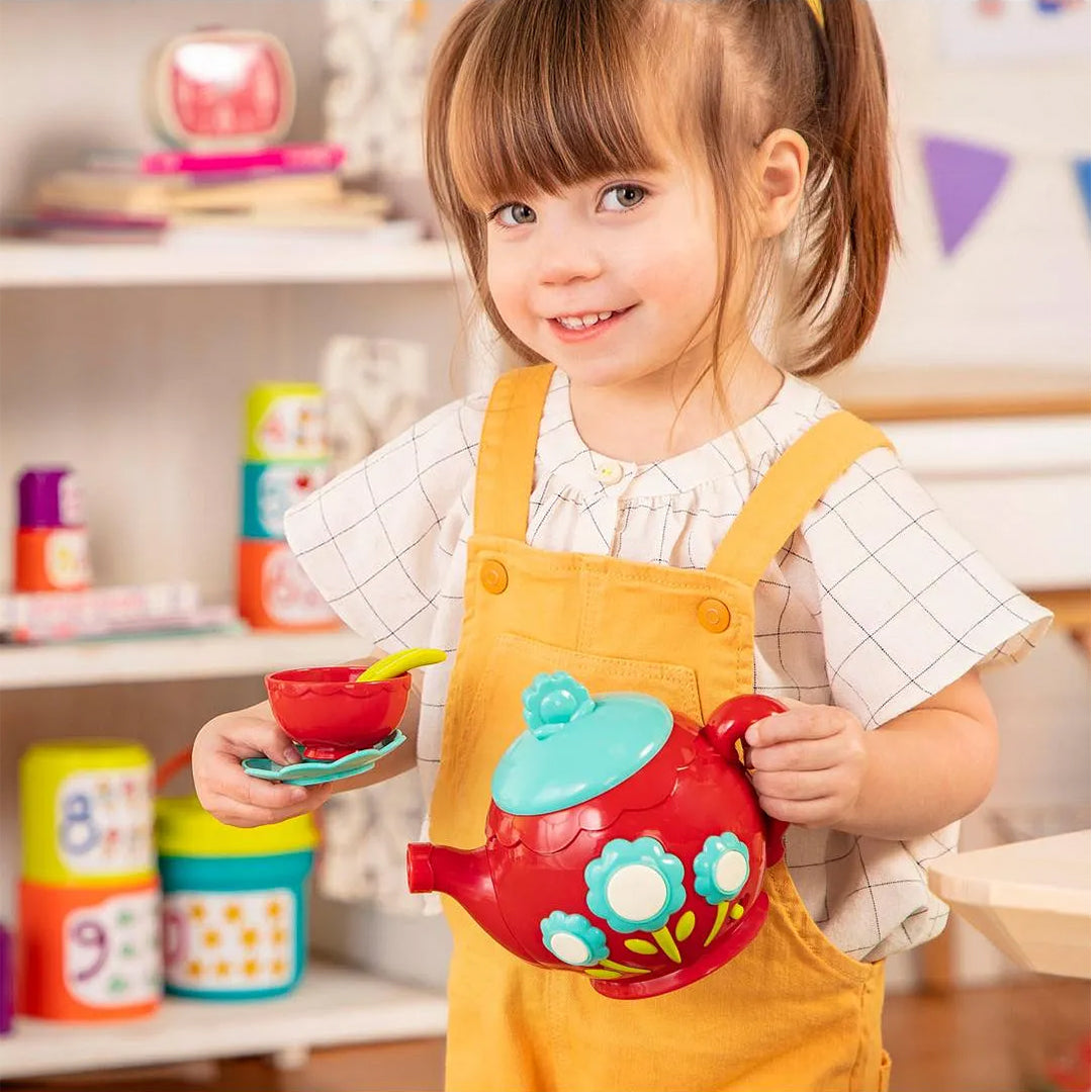 Child playing with the Battat Musical Tea Set