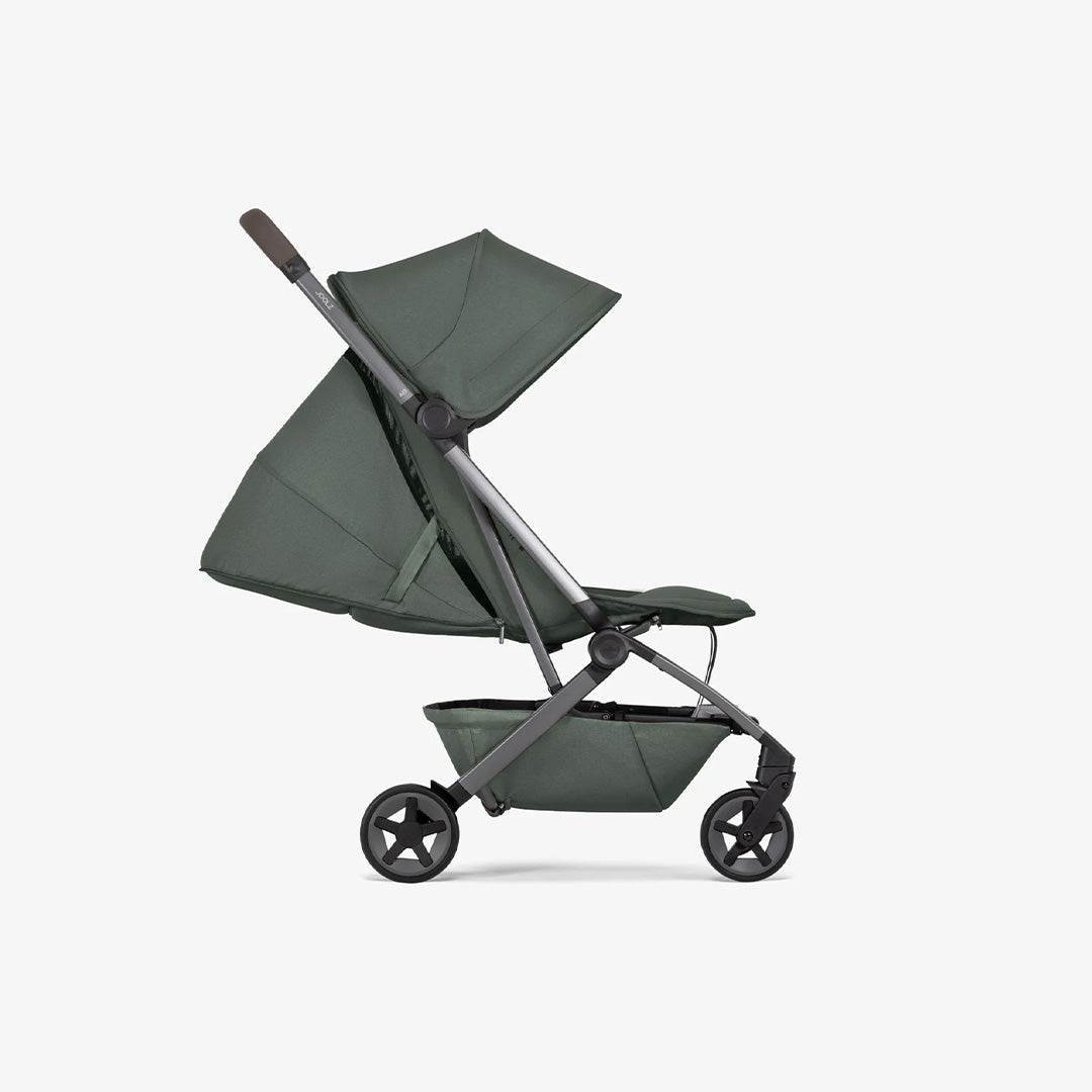 Side profile of the Forest Green stroller, showcasing the sleek black frame contrasting with the deep green canopy and seat fabrics.