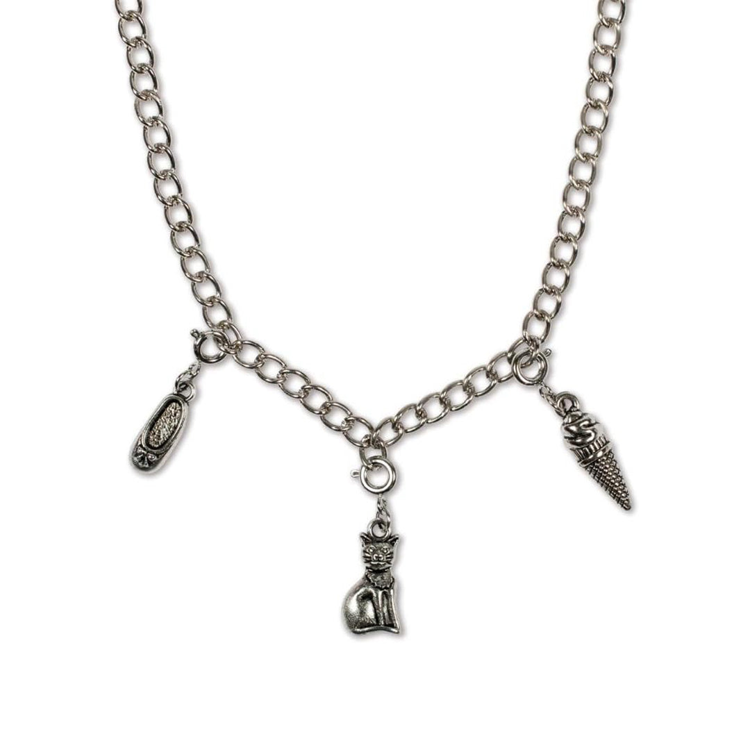 Girl crafting with non-toxic toys silver and colored charms.
