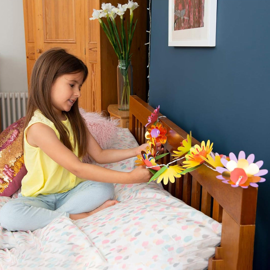 Child coloring paper petals with educational toys for kids fibre pens.