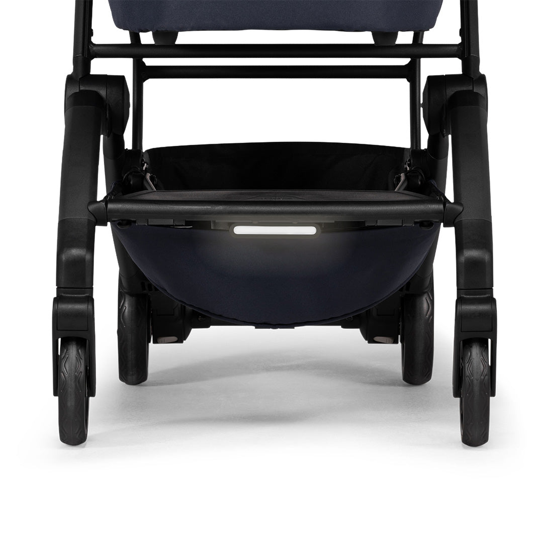 Close-up of the LED light clipped onto the frame of a Joolz stroller, demonstrating the seamless fit and modern design.