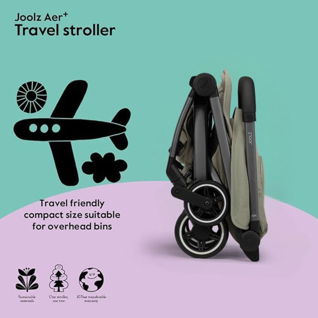 A parent effortlessly carrying the Forest Green carrycot by its foldable bumper bar, demonstrating how lightweight and portable the bassinet is for travel.