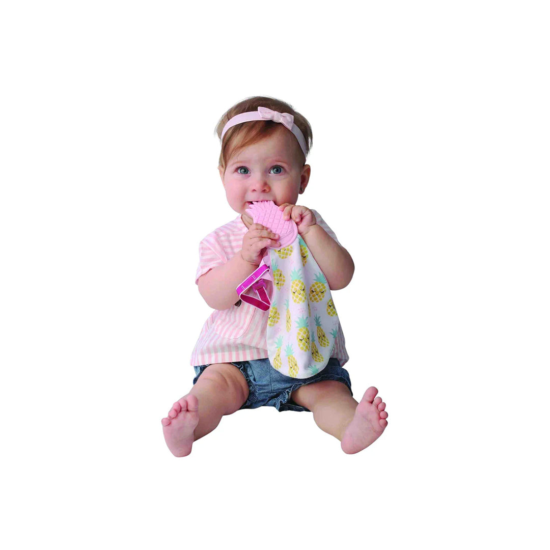 Baby snuggling non-toxic toys teething blanket on a baby play mat.
