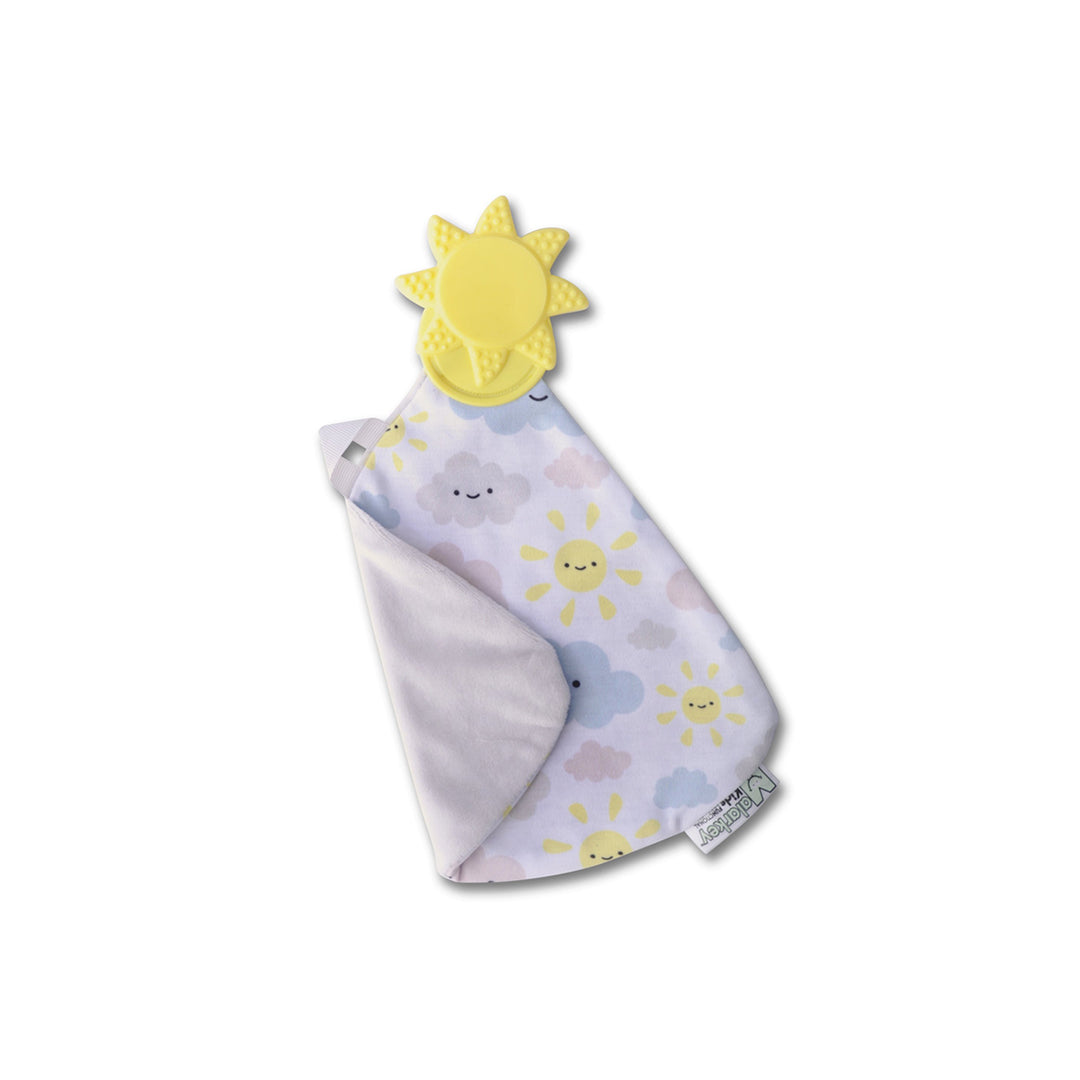 Munch-it Blanket used during screen-free play in an outdoor play area.