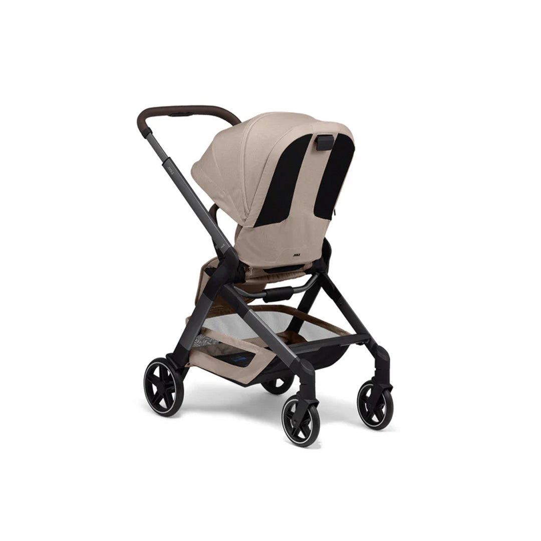 Close-up of the extendable Sandy Taupe sun hood with the mesh ventilation window open, ensuring airflow and UPF 50+ protection for the child.